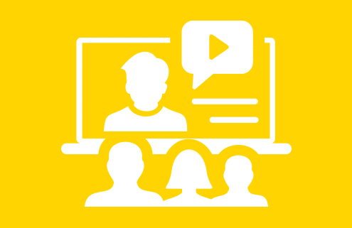 Icon eines Videos auf einem Rechner, vor dem drei Personen sitzen.